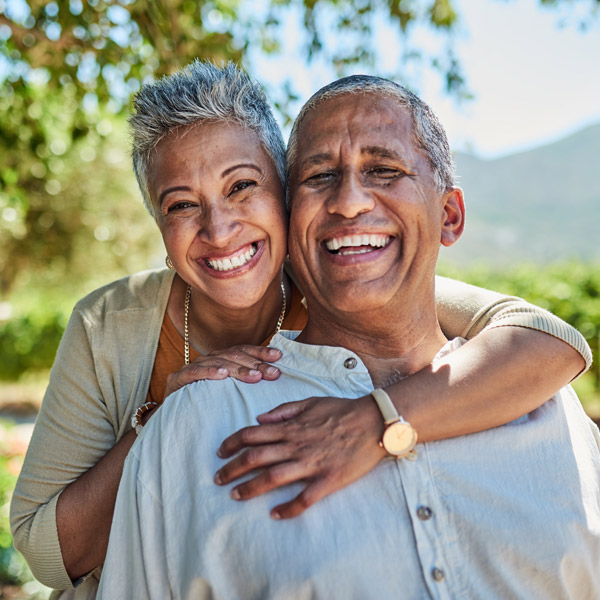 mature couple smiling together outside