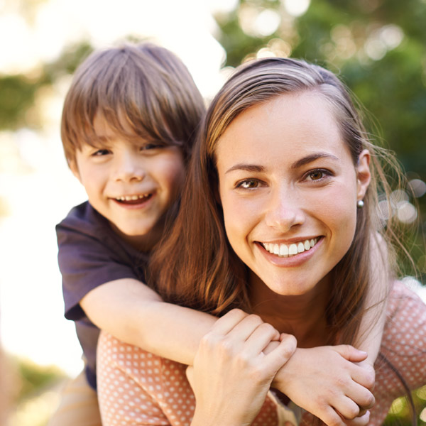 woman and son smiling together